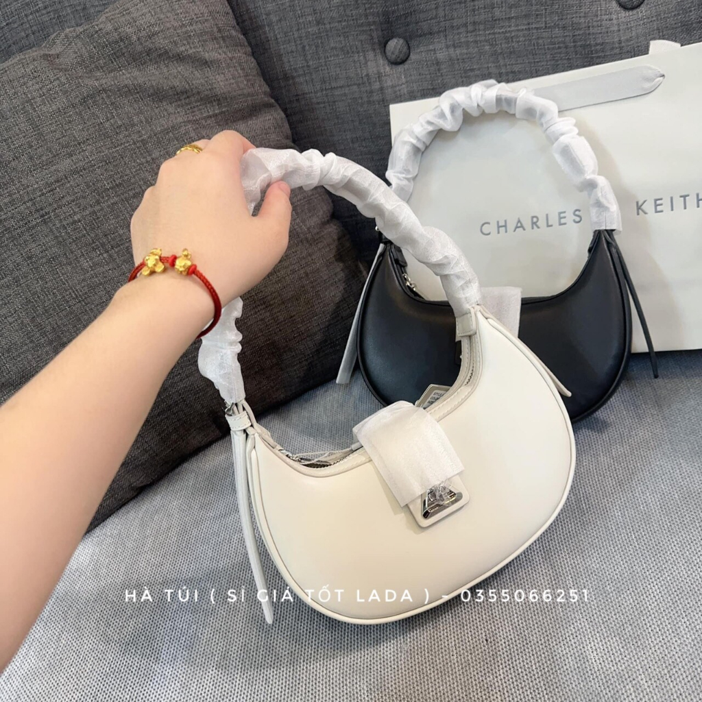 Túi kẹp nách Cê ka trơn dáng bầu cong khóa xoay