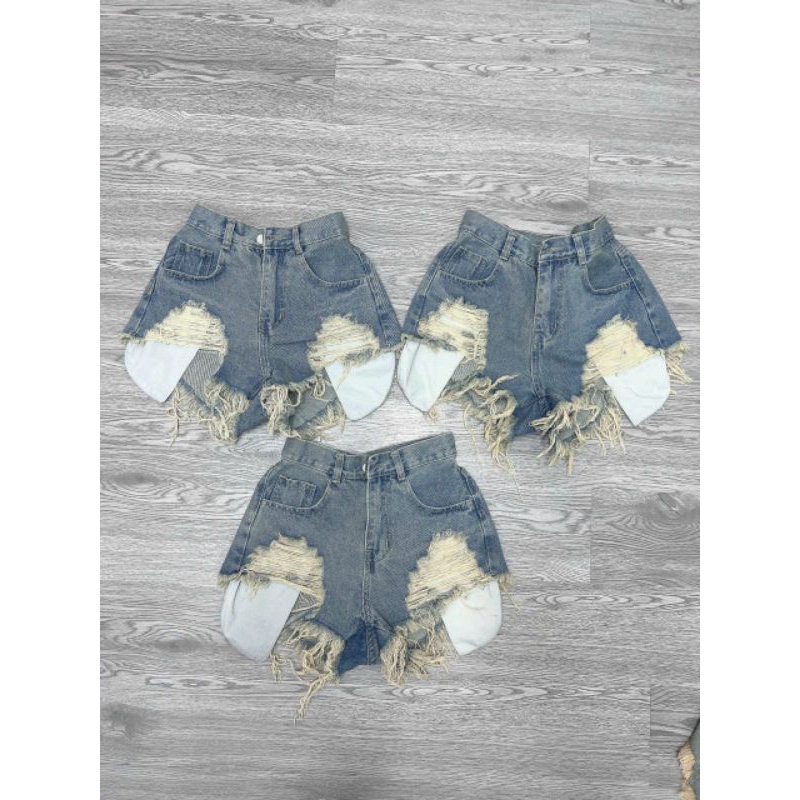 Quần short denim rách lưng cao phối túi tua rua