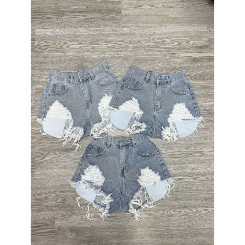 Quần short denim rách lưng cao phối túi tua rua