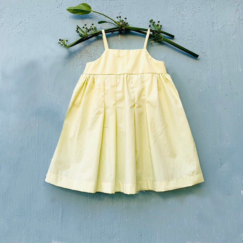 Đầm cho bé gái ALINA 2 dây pli, chất thô cotton thoáng mát, màu vàng mơ và cam sữa