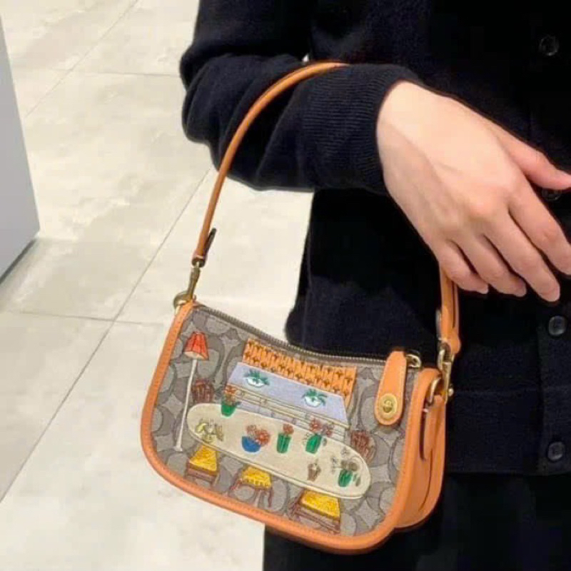 Túi coach swing kẹp nách cho nữ