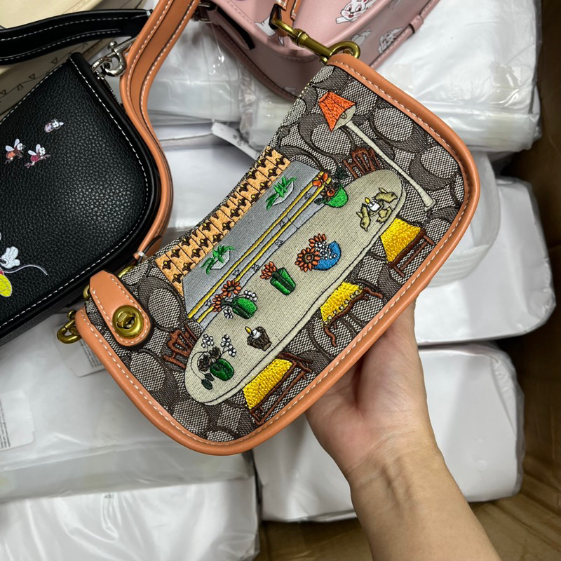 Túi coach swing kẹp nách cho nữ