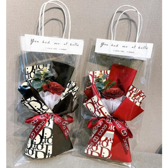 (Giá sỉ)Một bông hoa hồng nhũ đỏ kèm túi như hình làm quà tặng valentine, 8/3 20/10 (CHỈ HỎA TỐC HN)
