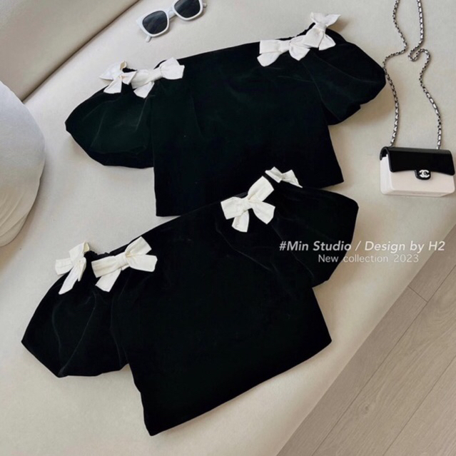 JENNYCLOSET | Áo nhung trễ vai crotop tay bồng đính nơ sang chảnh , Áo hở vai nhung cao cấp đính nơ tiểu thư