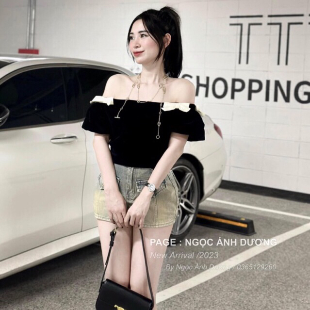 JENNYCLOSET | Áo nhung trễ vai crotop tay bồng đính nơ sang chảnh , Áo hở vai nhung cao cấp đính nơ tiểu thư