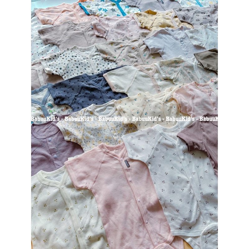 Bộ đồ liền thân cotton tay ngắn cài cúc trước Body chip Bodysuit cộc tay cho bé trai và gái hoạ tiết