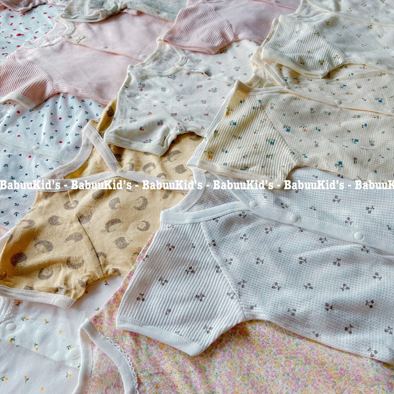 Bộ đồ liền thân cotton tay ngắn cài cúc trước Body chip Bodysuit cộc tay cho bé trai và gái hoạ tiết