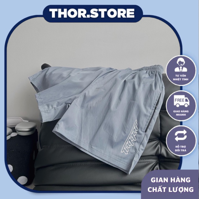 Quần short dù unisex in chữ Trip màu xanh