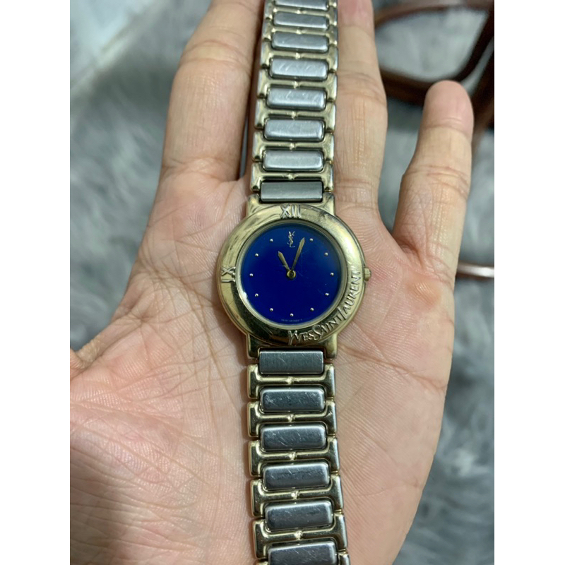 Đồng hồ YsL mặt xanh 2080038 tình trạng đa cũ