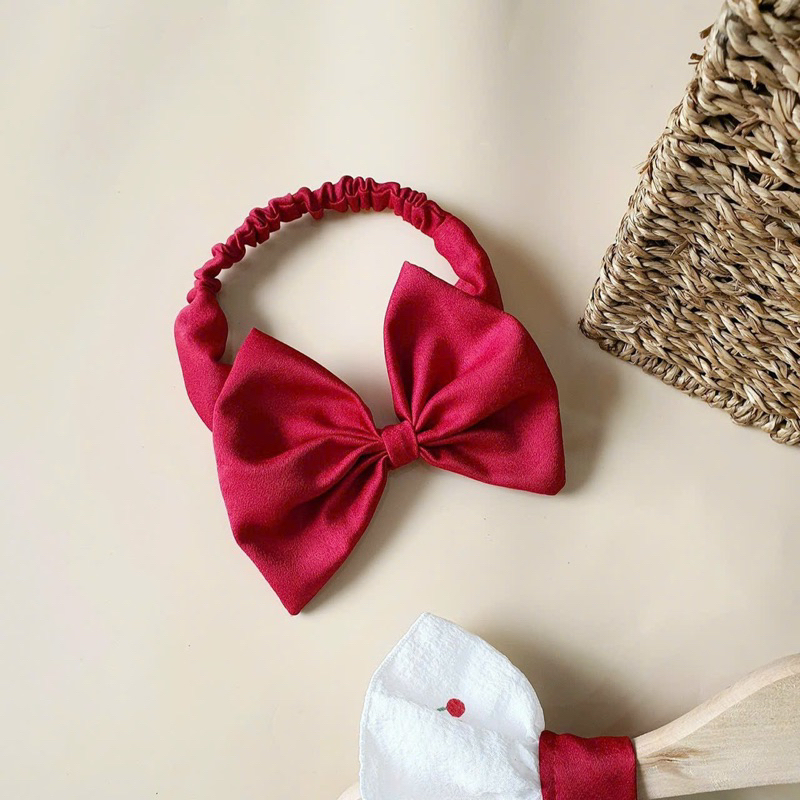 Body đỏ kèm nơ cho bé gái