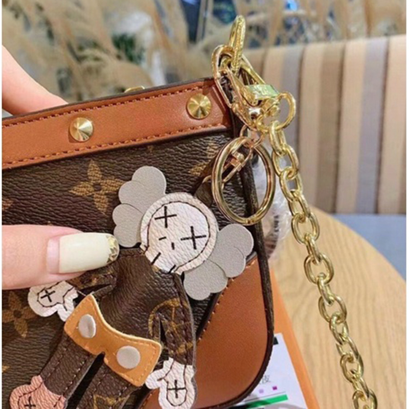 Túi Xánh Nữ Túi kẹp nách L.V kèm gấu thời trang mới, Mã T 29