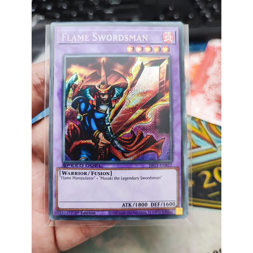1 lá thẻ bài Flame Swordsman - SBC1-ENB22 - Secret Rare 1st Edition