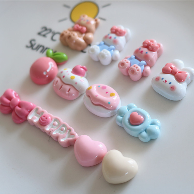 Sticker jibbitz gắn dép, charm gấu nâu thỏ trắng thỏ hồng, cupcake, Happy, nơ hồng nhựa bóng