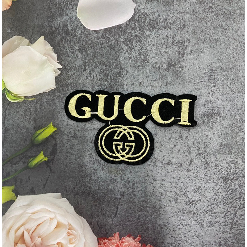 Logo thêu chữ Gucci đính quần áo