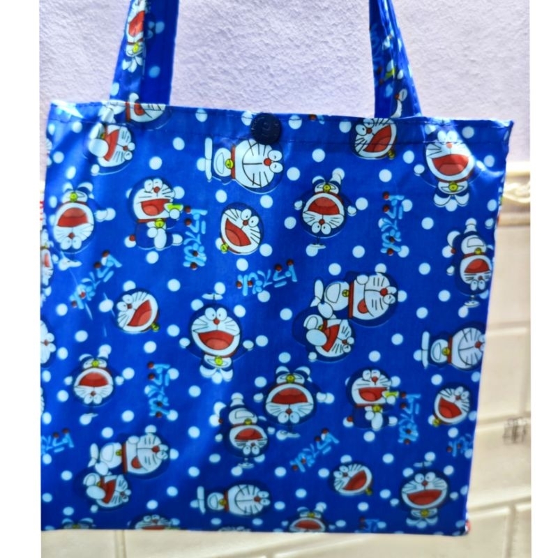 Áo mưa bít vải dù doraemon,picachu,hình thú dễ thương