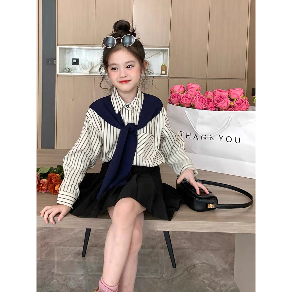 Set áo sơ mi kẻ sọc phối chi tiết buộc cổ và chân váy xòe năng động cho bé gái Danchau 789