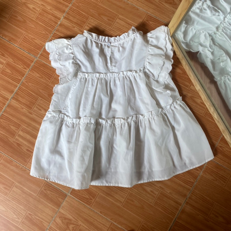 Áo baby doll trắng xoè tay cánh tiên