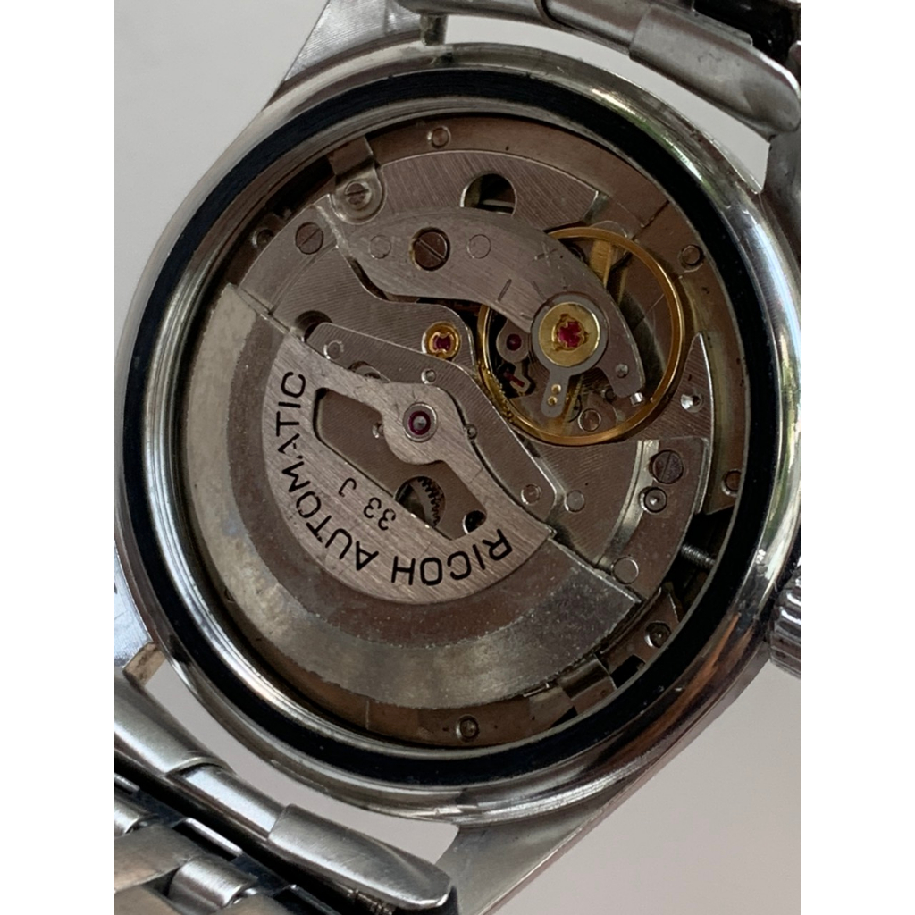 Đồng hồ nam Ricoh automatic, niềng răng cưa, dây kim loại của Nhật