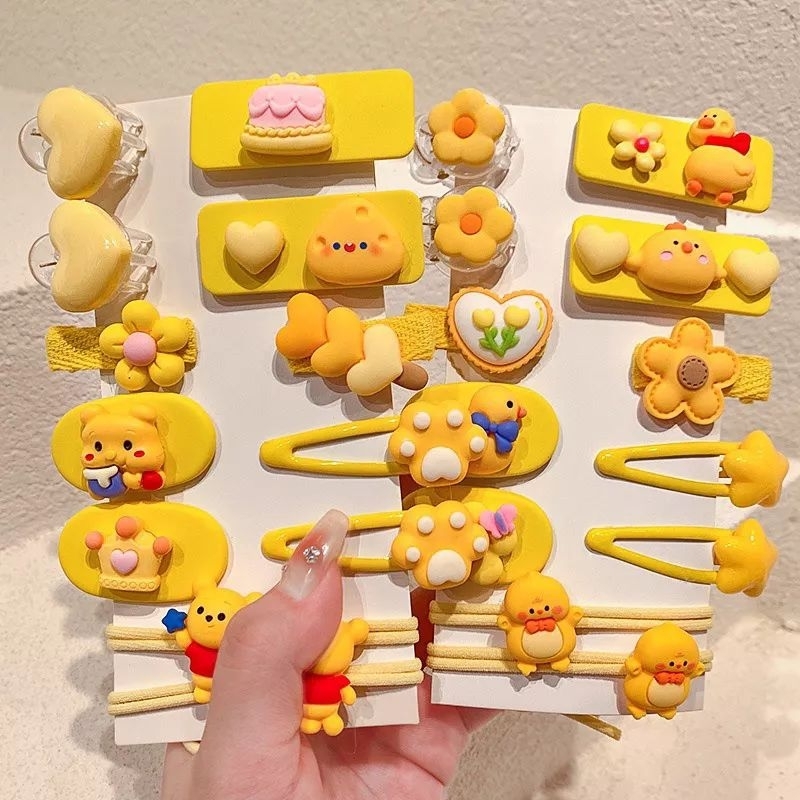 Vĩ 12 kẹp mái kèm cột tóc hoạt hình siêu dễ thương bé nào cũng mê.