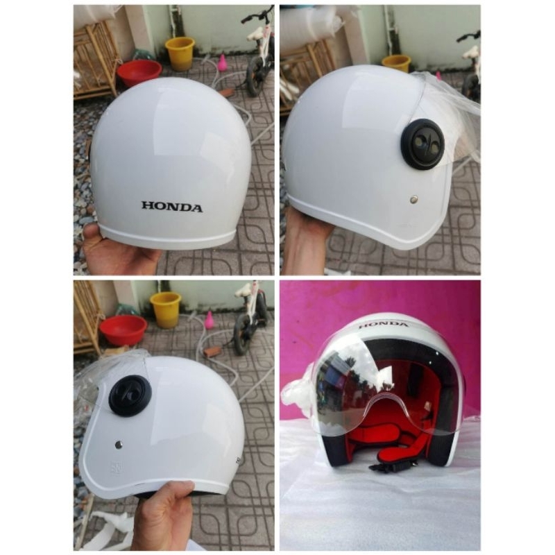Nón mũ bảo hiểm Honda trắng 3/4 có trầy xước.