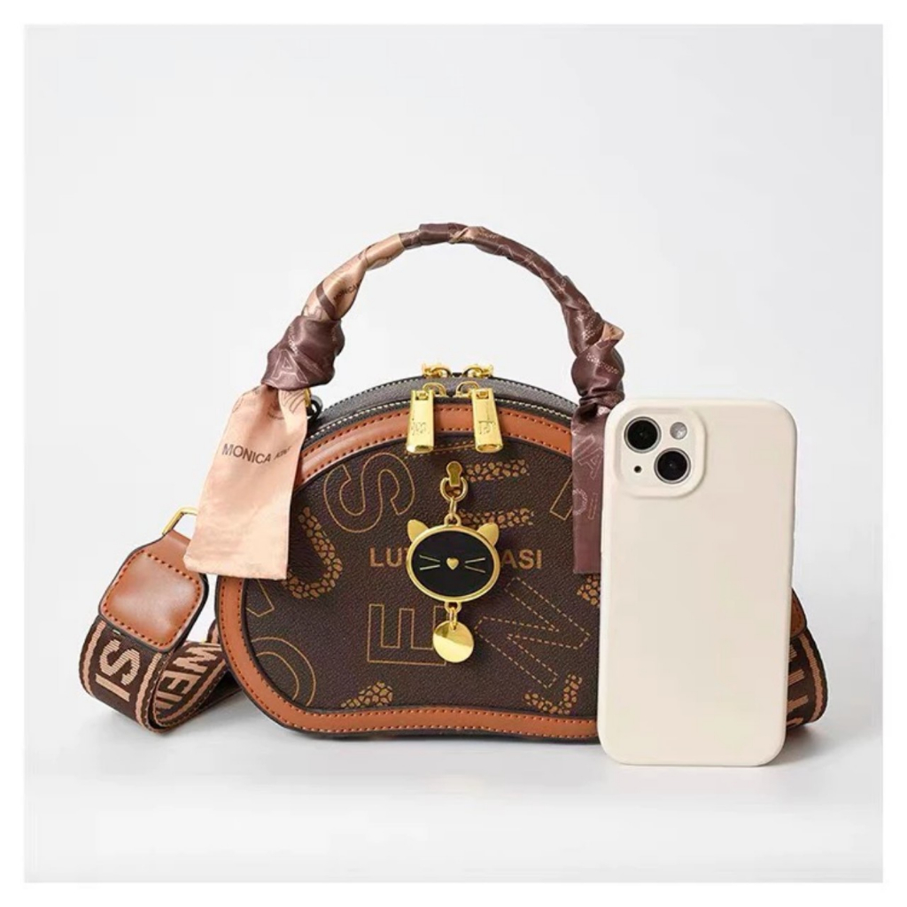 Túi xách nữ đeo chéo móc mèo cầm tay dáng trống pamoli_ TDC129