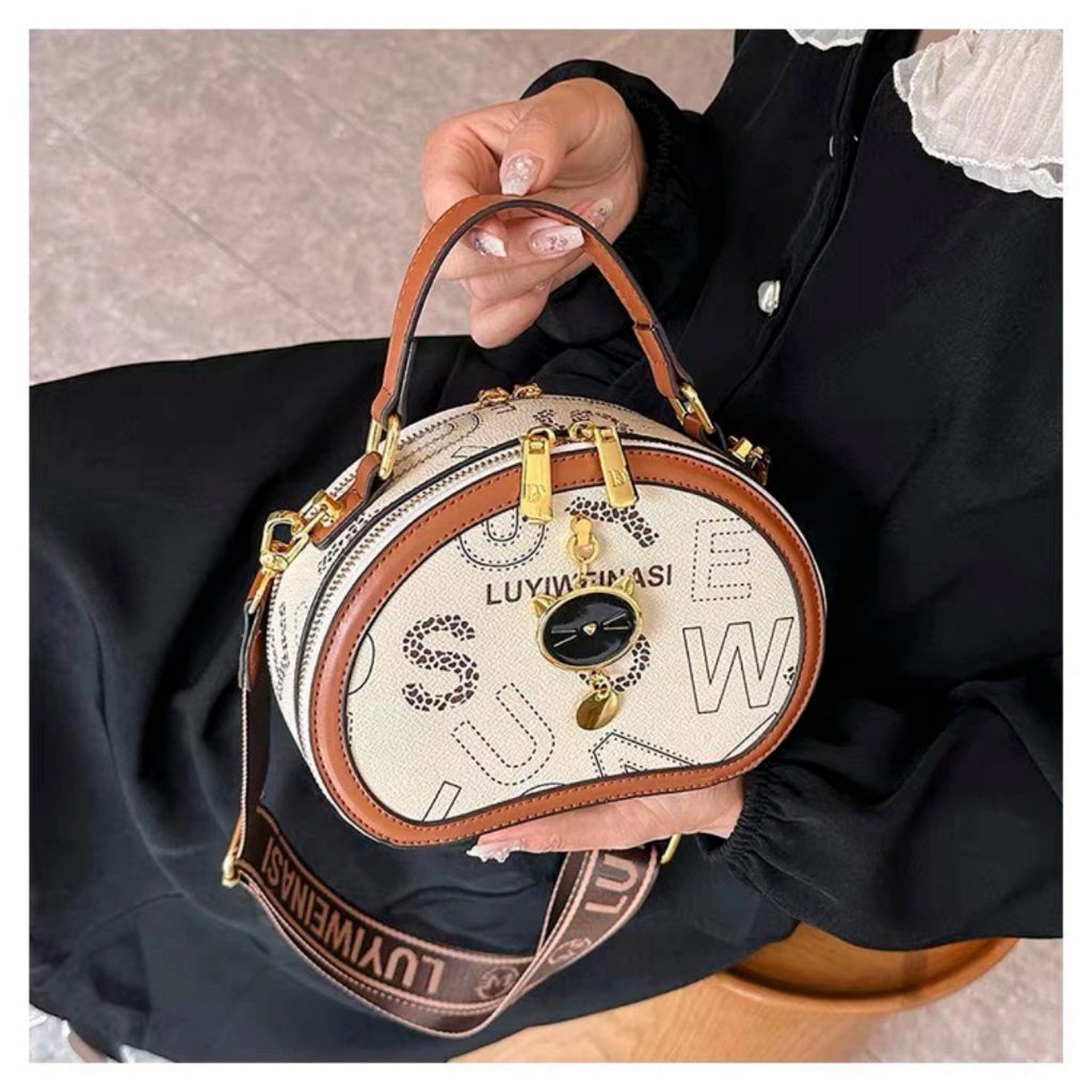 Túi xách nữ đeo chéo móc mèo cầm tay dáng trống pamoli_ TDC129