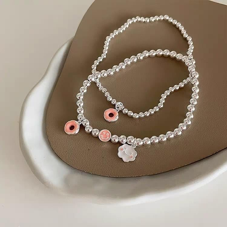 Vòng tay dây cước charm mặt cười - hoa cúc - bánh donout