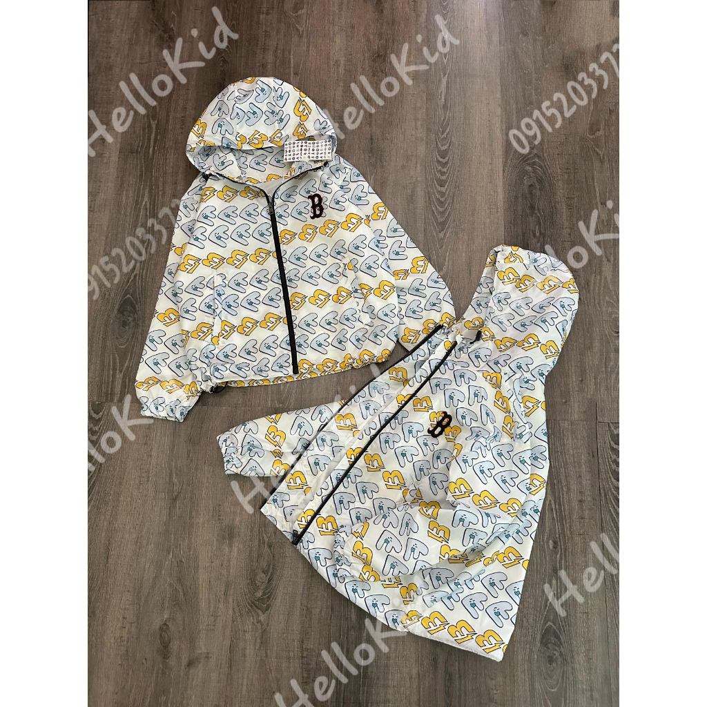 Áo gió 2 lớp trắng phối hoạ tiết vàng xanh thêu B