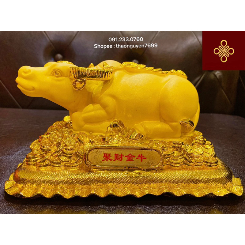 Tượng trâu phong thuỷ màu vàng kim sa dáng nằm .(cao 12, dài 22, rộng 14)