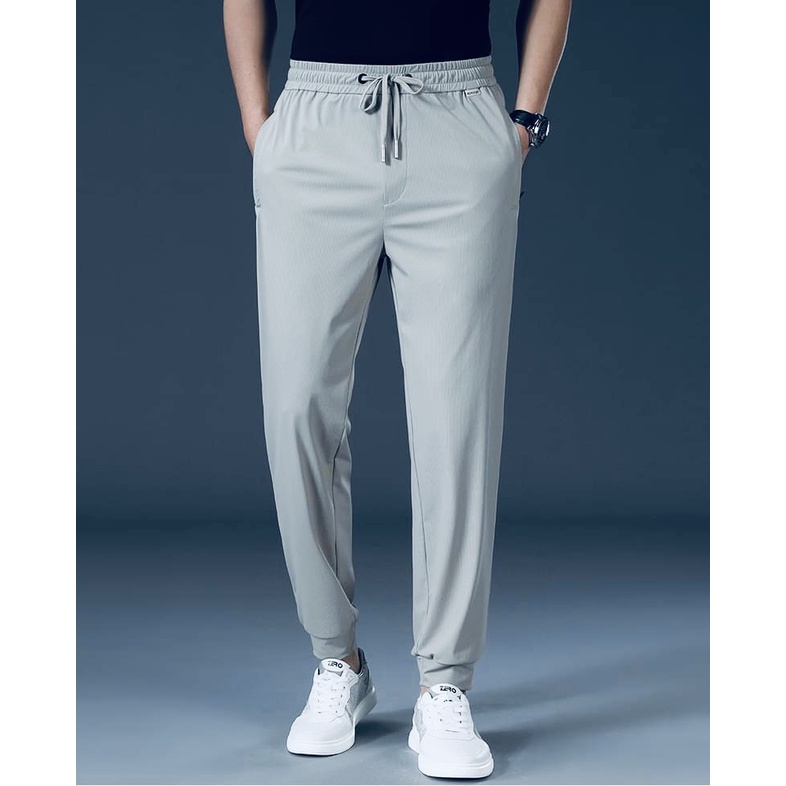 Quần dài thể thao nam vải POLY co giãn cạp thun dây rút