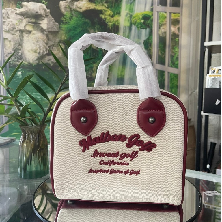 Túi cầm tay nữ malbon- túi cầm thể thao nữ