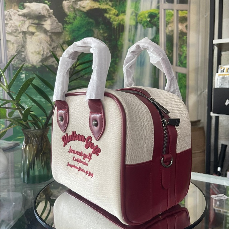 Túi cầm tay nữ malbon- túi cầm thể thao nữ