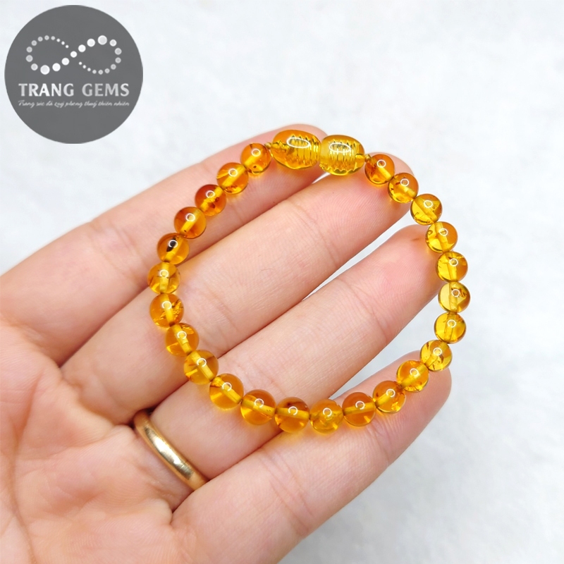 Vòng tay hô -phách charm bạc