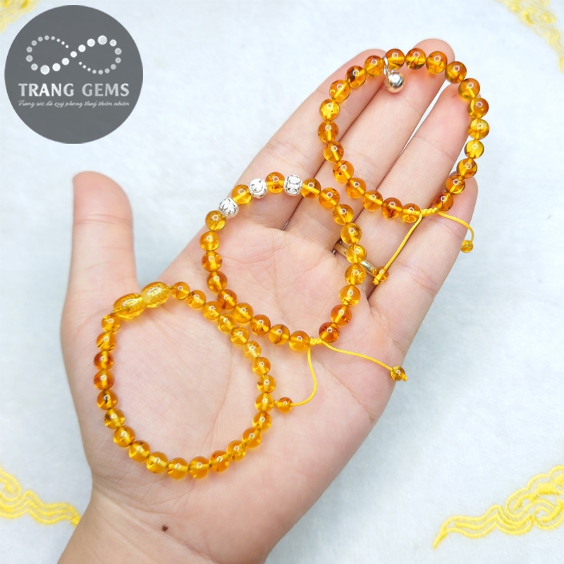 Vòng tay hô -phách charm bạc