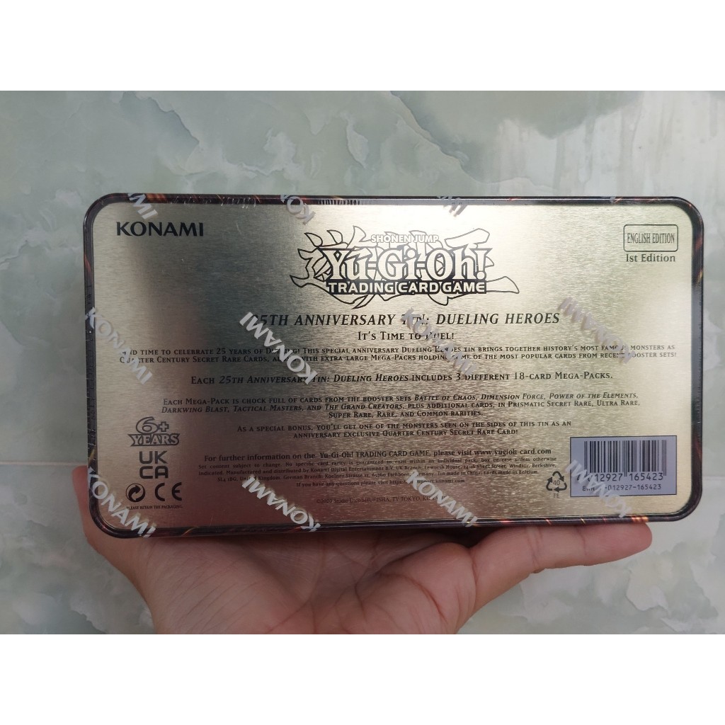 Hộp Megatin UK 2023 25th Anniversary Tin: Dueling Heroes