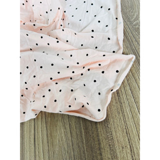 Vải thun cotton 2c chấm bi đen nền cam nhạt