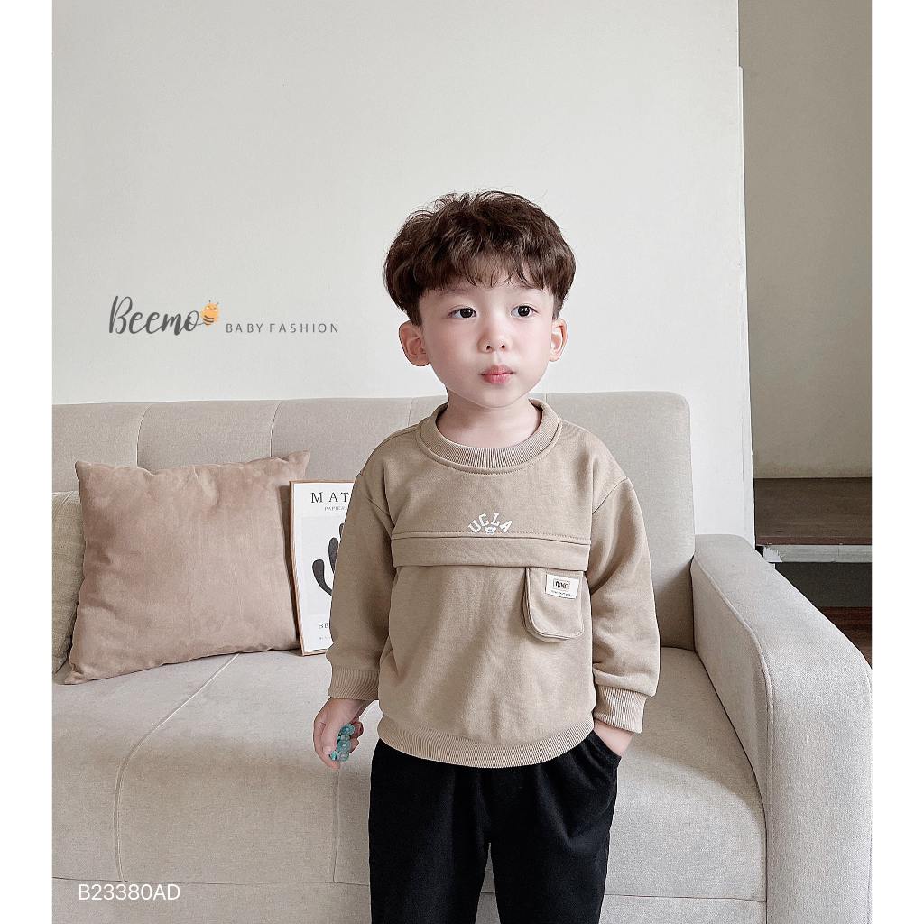 Áo sweater dài tay thân phối túi ngực tag da Beemo cho bé