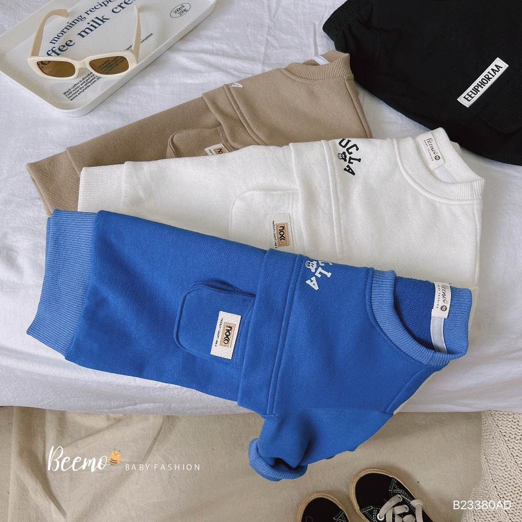 Áo sweater dài tay thân phối túi ngực tag da Beemo cho bé