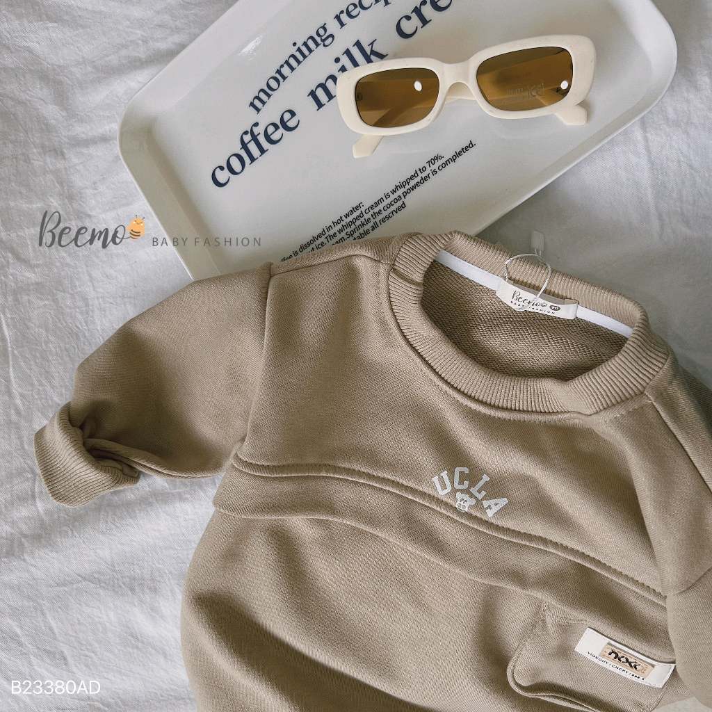 Áo sweater dài tay thân phối túi ngực tag da Beemo cho bé