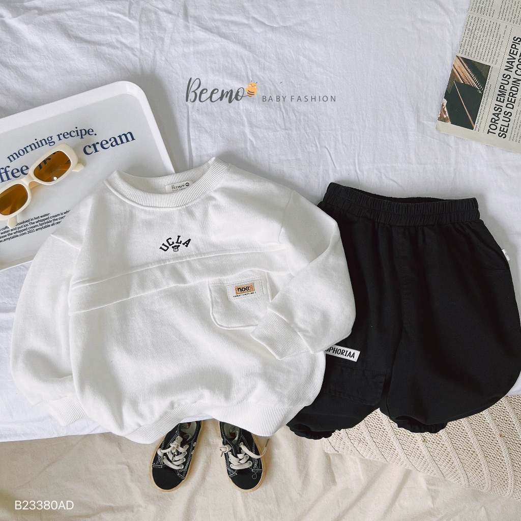 Áo sweater dài tay thân phối túi ngực tag da Beemo cho bé