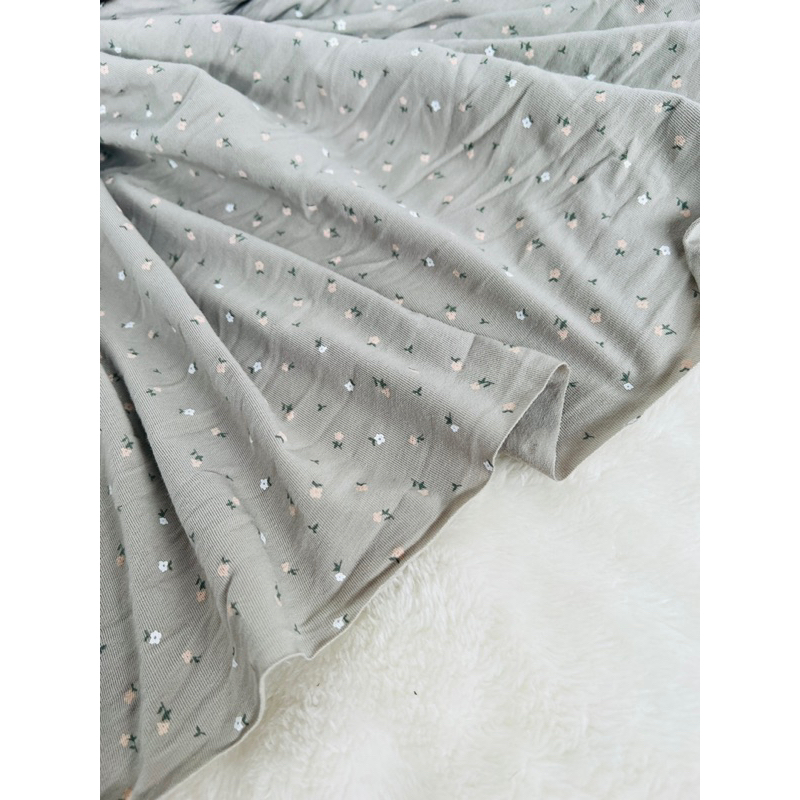 Vải thun cotton 4c hoa nhí nền xanh vỏ đậu nhạt