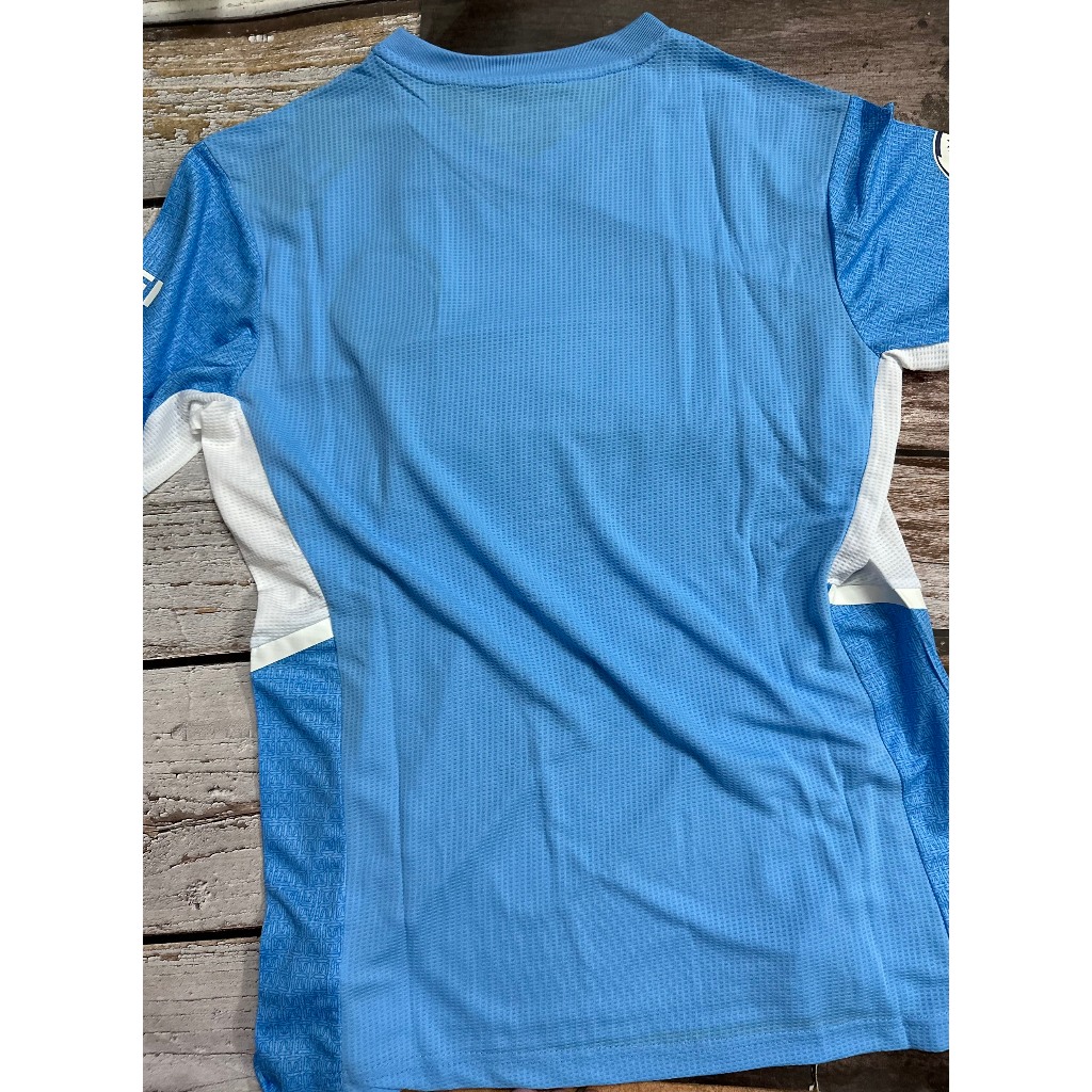 Set bộ bóng đá MC 2021 sân nhà màu xanh quần xẻ tà