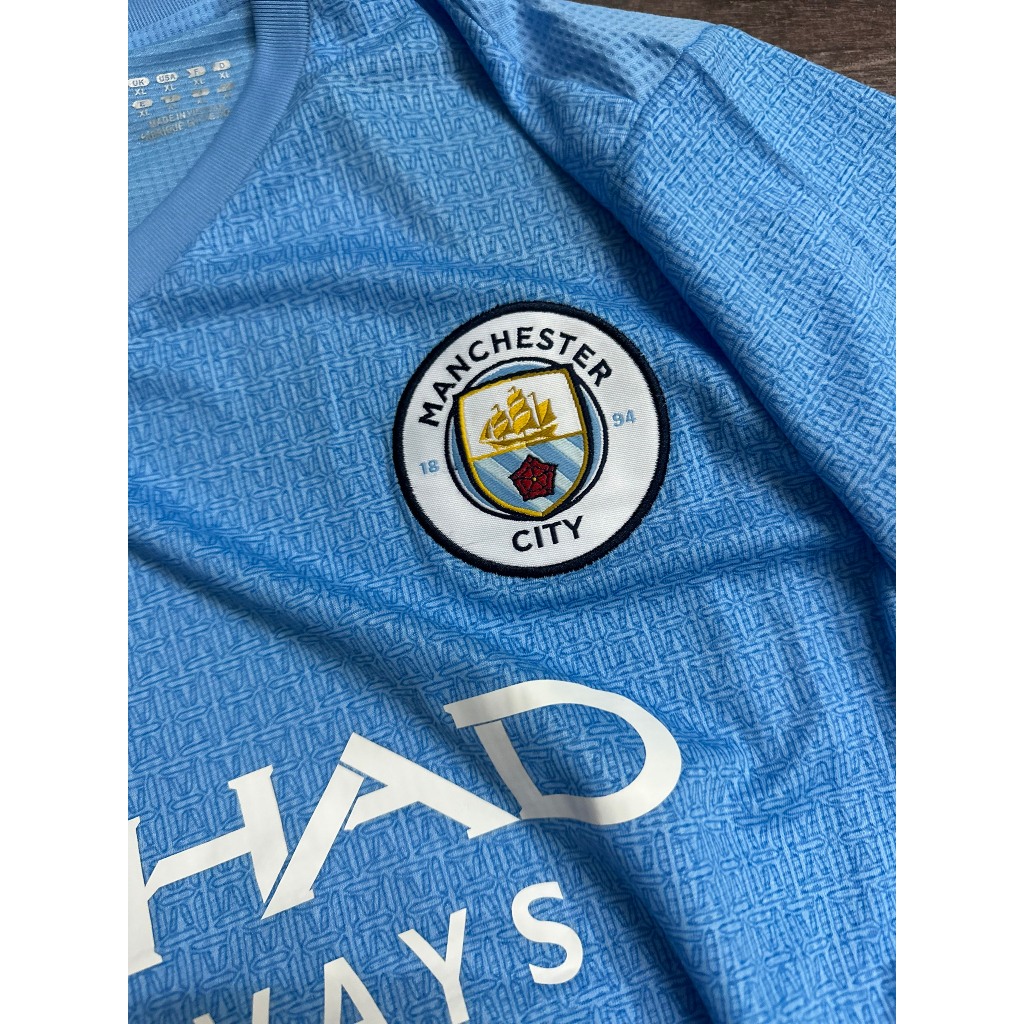 Set bộ bóng đá MC 2021 sân nhà màu xanh quần xẻ tà