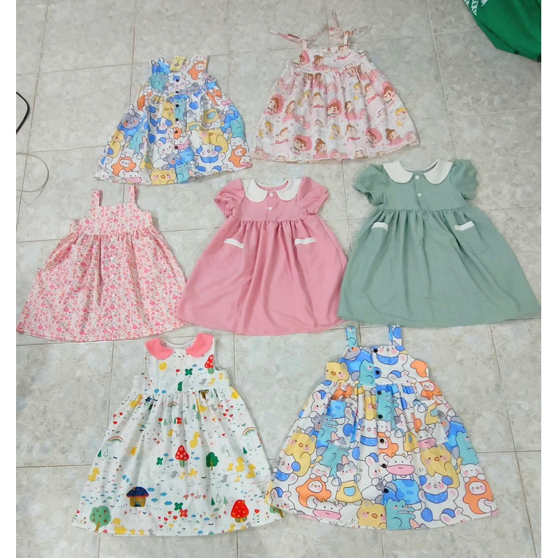 Đầm hoa vải lụa thô cho bé gái 9-15kg