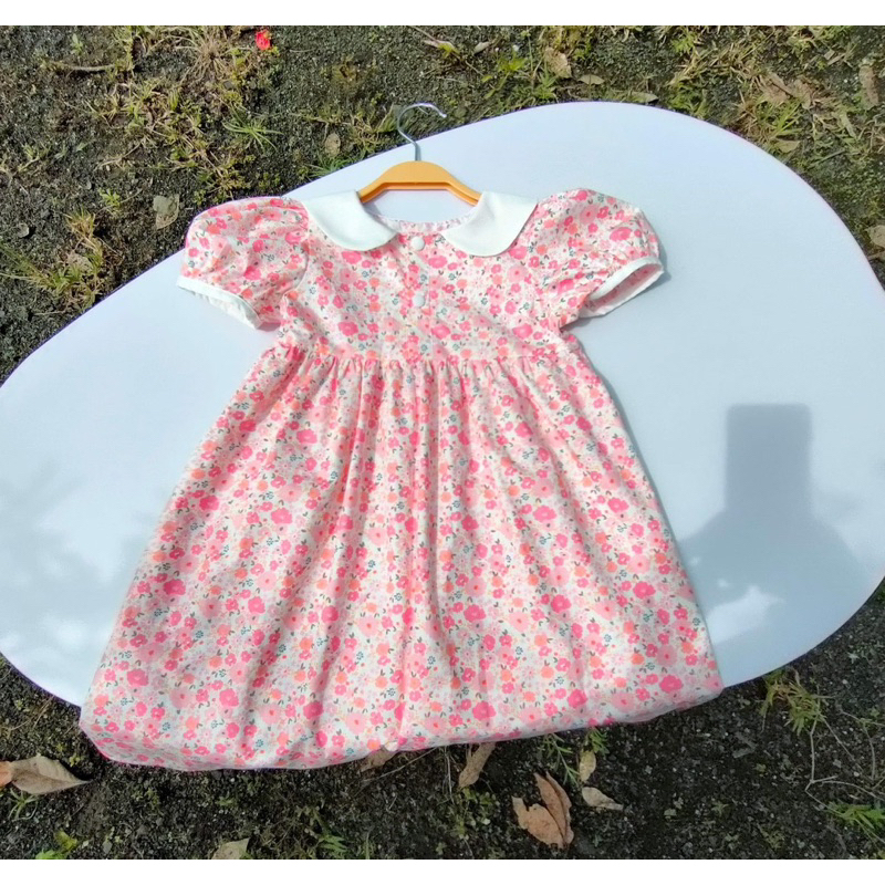 Đầm hoa vải lụa thô cho bé gái 9-15kg