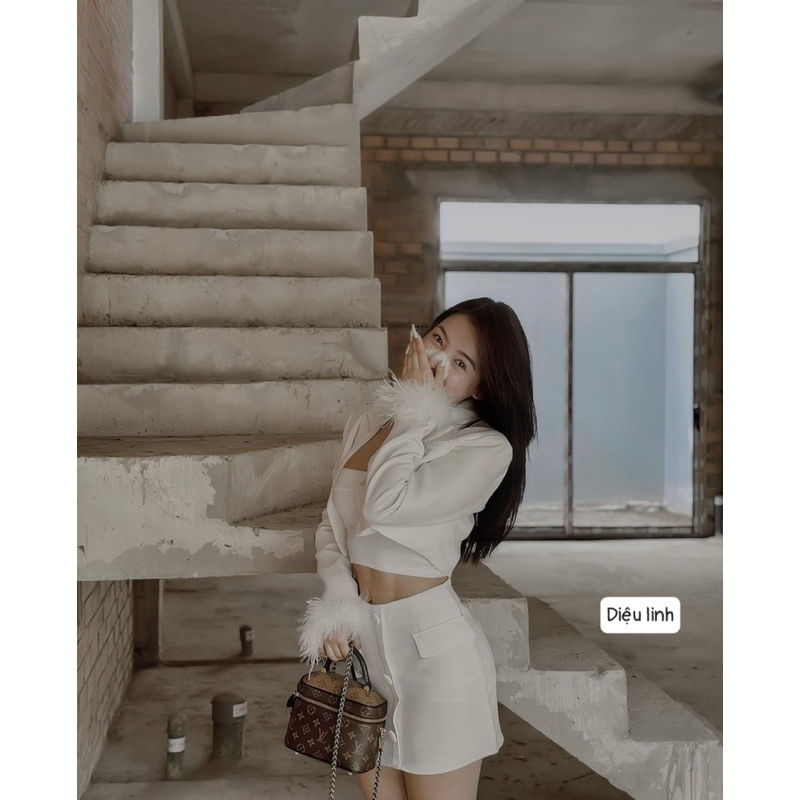 Set áo vest tay lông + chân váy ngắn cúc bọc