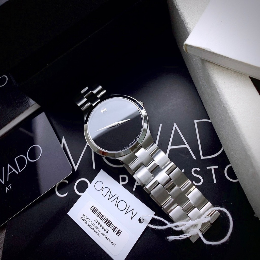 ĐỒNG HỒ CẶP MOVADO 0607199 khung thép trắng- Máy swiss made- Size 40/26mm- chống nước- bảo hành 24 tháng