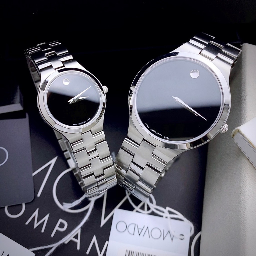 ĐỒNG HỒ CẶP MOVADO 0607199 khung thép trắng- Máy swiss made- Size 40/26mm- chống nước- bảo hành 24 tháng
