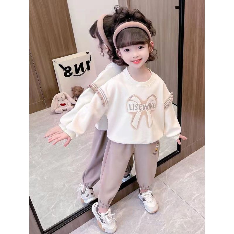 Bộ quần áo nỉ thu đông bé gái 18-55kg hình NƠ.Chất vải da cá mềm,hình in xinh xắn.BG53