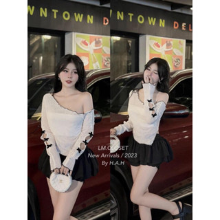 SET ÁO LEN LỆCH VAI ĐÍNH NƠ TAY DÀI VẠT NHỌN PHỐI CHÂN VÁY TẦNG ( có lót )